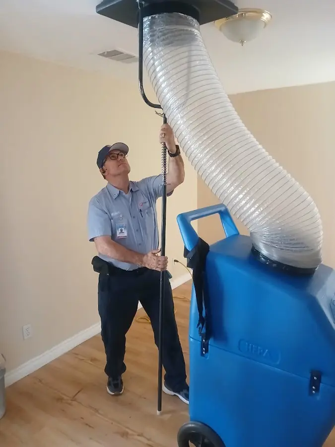 Furnace Tune-Up technician using HEPA equipment in Bothell